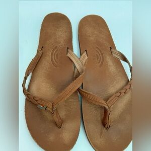 Rainbow tan flip flops.